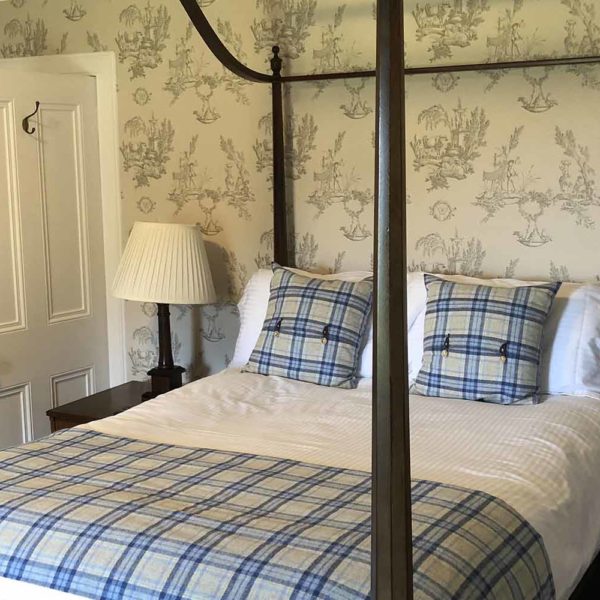 A four poster bed in Kilchoman House at Islay Cottages