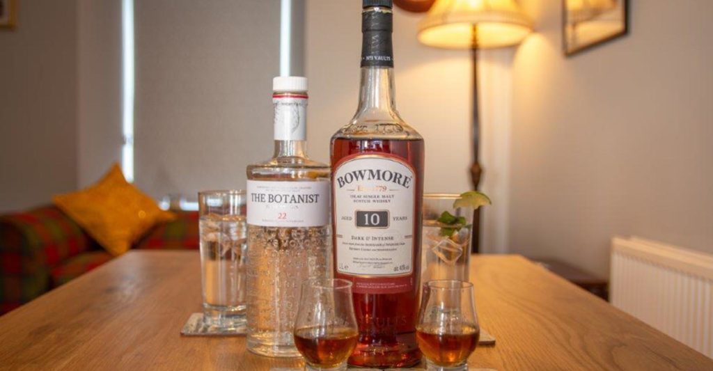 A bottle of whisky and The Botanist gin at Tarbet House bed and breakfast on Islay