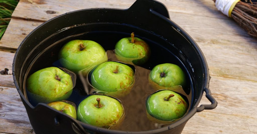 Apples in a cauldron for bobbing