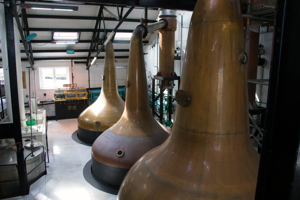 Large whisky stills at Bowmore Distillery on Islay